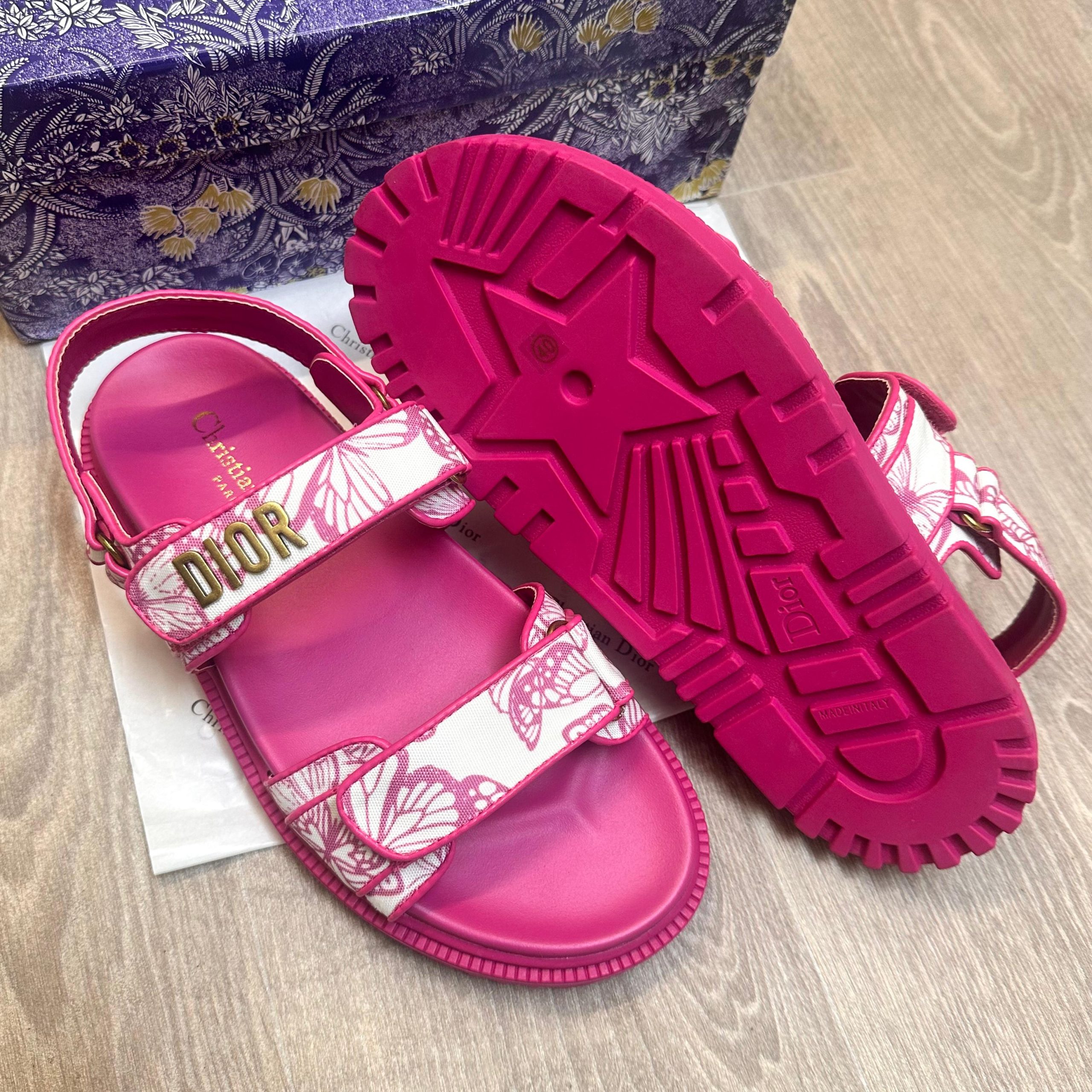 Dior Act Women Butterfly Allover Motif Pink Sandals 7a Quality Replicas are the first copy products such as copycats shoes, watches, clothing, bags, and electronics. Dior Act Women Butterfly Allover Motif Pink Sandals - Image 3